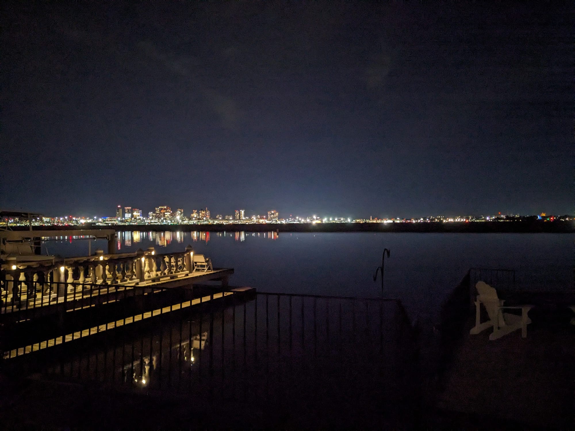 The night view from the back of my current residence, showing Boston Harbor and the glowing skyline.